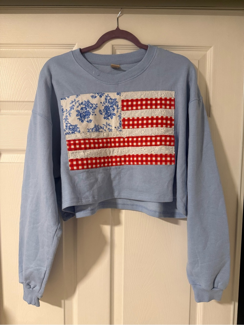 Light Blue Cropped Crewneck Sweater with Red Gingham Patch